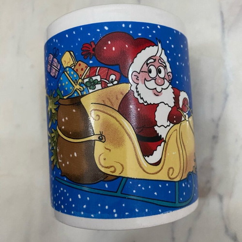 Christmas coffee mug like new with Santa Claus and reindeer