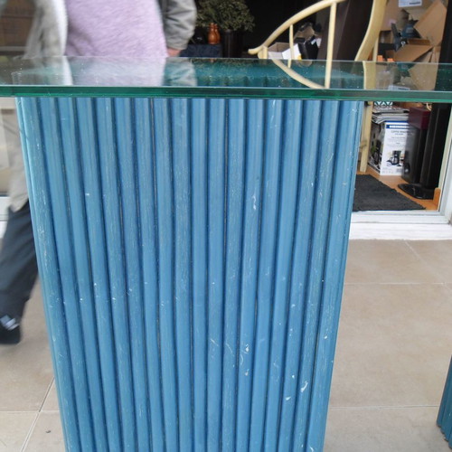 Console table used with 2 blue/navy bases and glass top