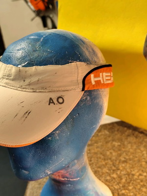 Head tennis visor used, white and orange