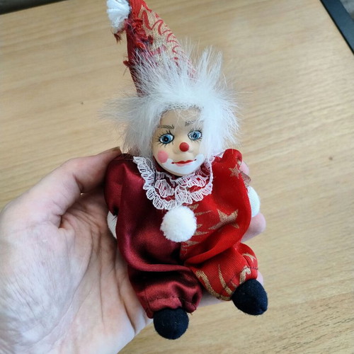 Decorative clown doll with movable head, used