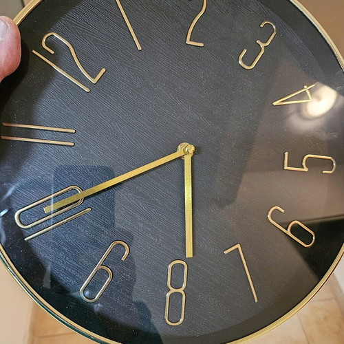 Wall clock like new with black dial and gold hands