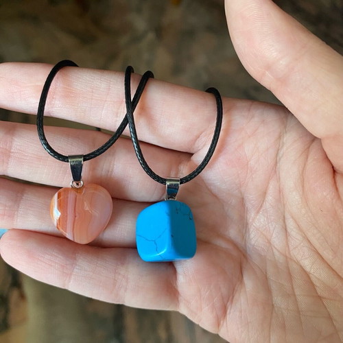 Pack of two crystal necklaces new with black cord unisex