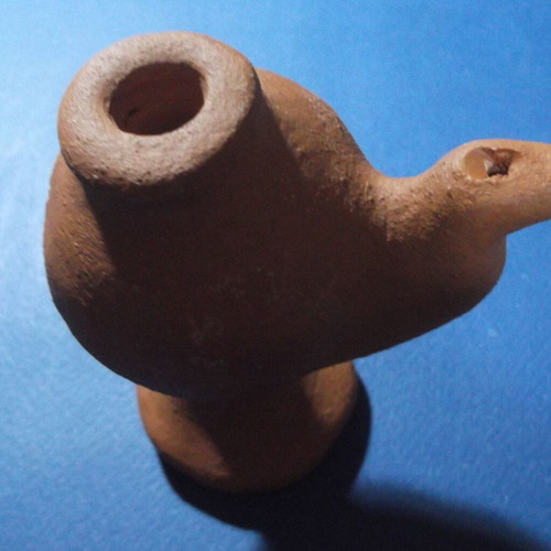 Clay oil lamp or water whistle with fleur-de-lis scouting emblem, used