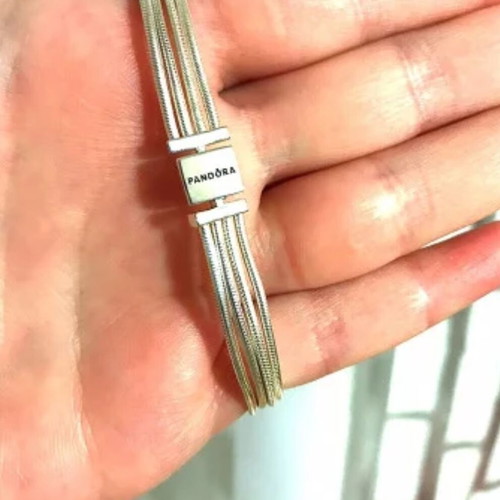 Pandora s925Ale Reflexions bracelet with four strands.