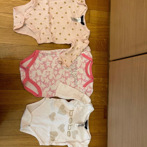 Three Calvin Klein and Bebe bodysuits used, cotton 6-9 months