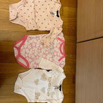 Three Calvin Klein and Bebe bodysuits used, cotton 6-9 months