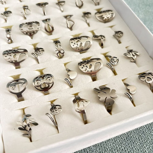 Box of 36 new steel rings with adjustable and fixed sizes