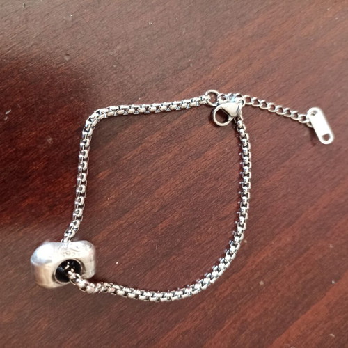 Chain bracelet with charm like new, silver color