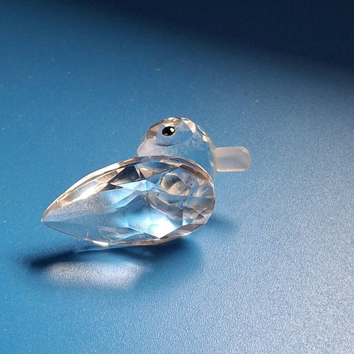 Glass figurines dolphin and duck used, mirror base