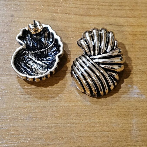 Metal earrings like new with ridges gold-colored