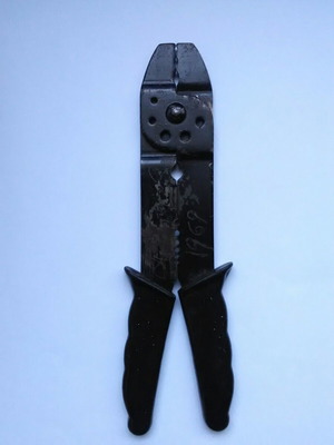 Electrician's multitool used with wire stripper, crimper, and cutter
