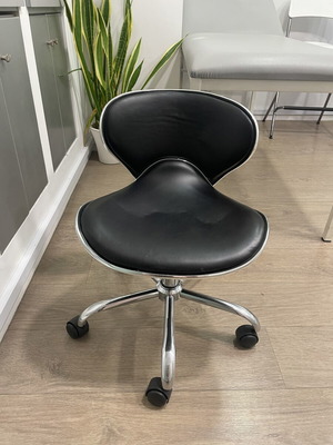 Work stool with backrest used, suitable for pedicure