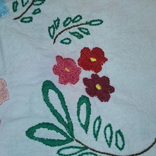 Vintage handmade embroidered tablecloth with flowers and needlework