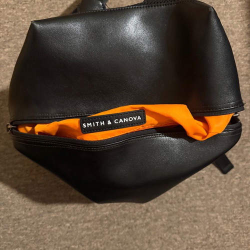 Leather backpack like new, black with orange lining