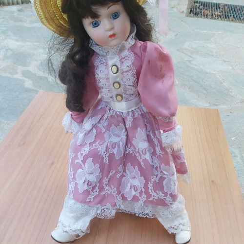 Porcelain doll new with stand for support