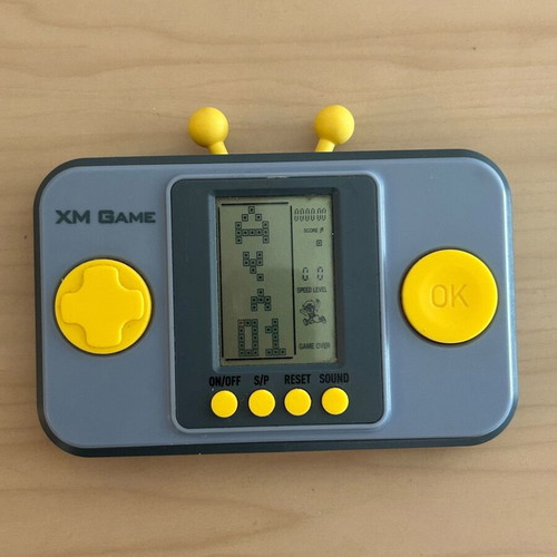Vintage XM Game handheld console with multiple games