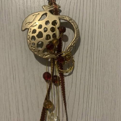 Hanging pomegranate charm new with gold and red ribbon