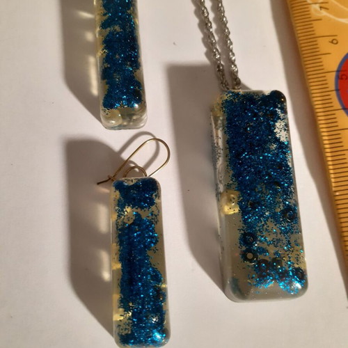 Set of 7 handmade pendant and earring jewelry sets with resin and dried herbs
