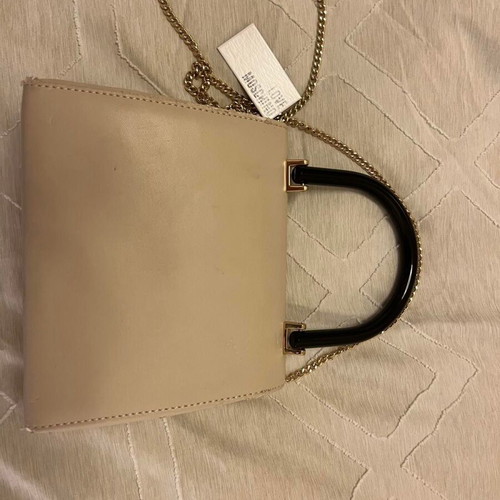 Love Moschino clutch handbag used, beige with black handle