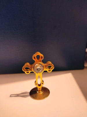 Cross gold plated with base approximately 5 cm height