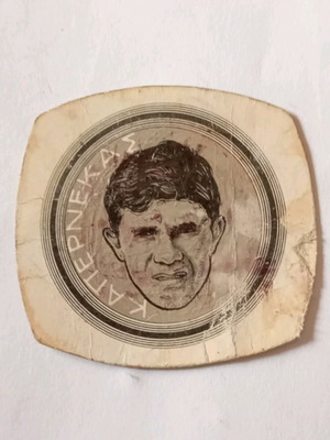 Sports memorabilia cap used with Spyros Kapernekas face 70s