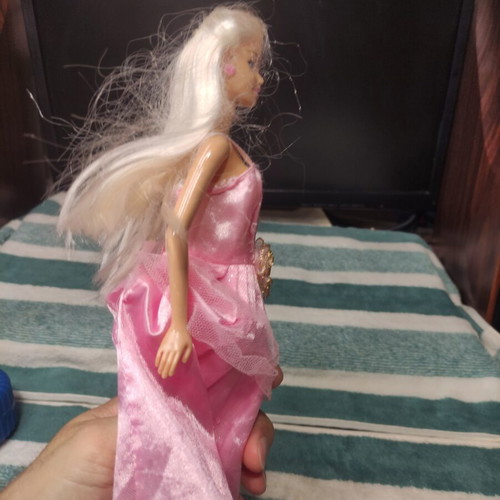 Barbie doll used with dress tears