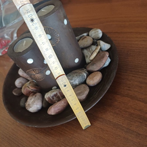 Decorative table set with stones and candles, new