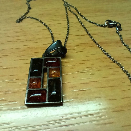 Silver pendant with Baltic amber like new