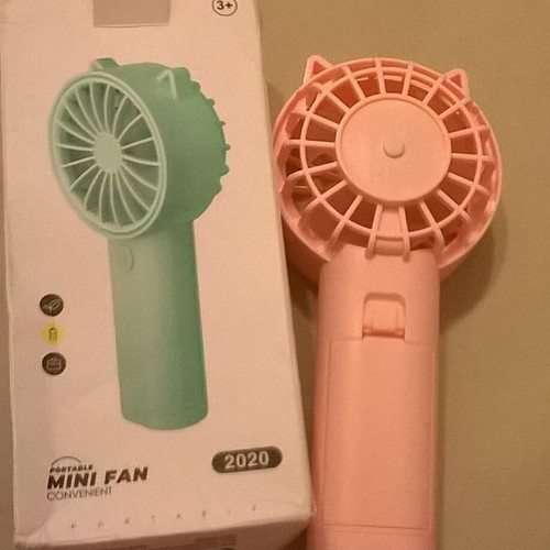 Pink Mini Fan like new with stable base, battery operated