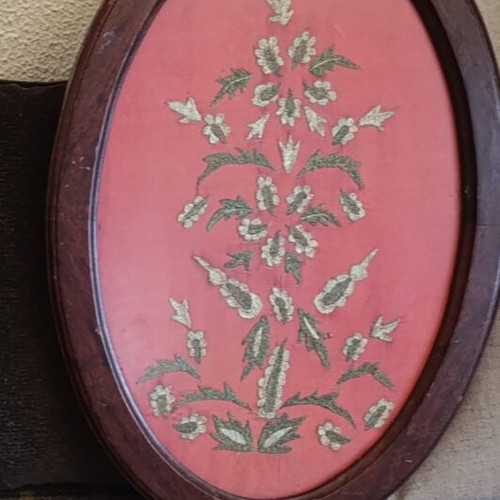 Embroidered textile painting with gold thread, used
