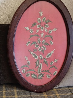 Embroidered textile painting with gold thread, used