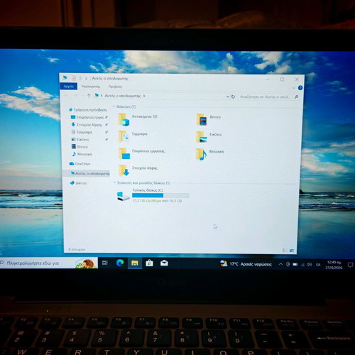 Quest Slimbook Plus 14.1" FHD laptop used with mouse and bag