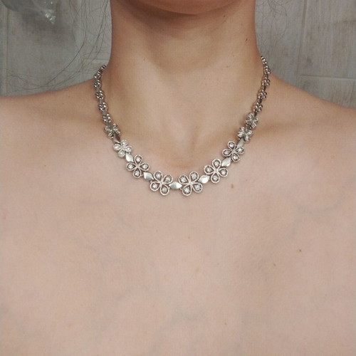 Riviera necklace with flower and four-leaf motifs, silver