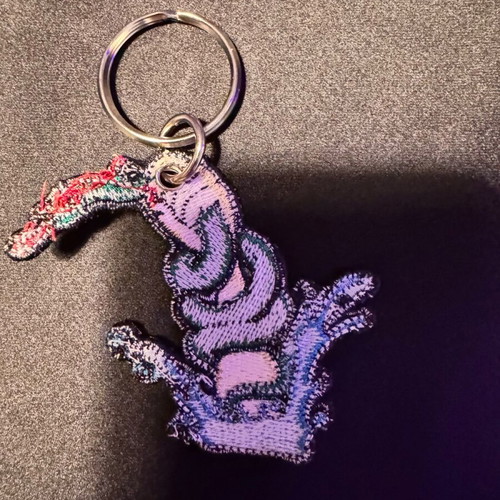 Caravan embroidered keychain like new, multicolor