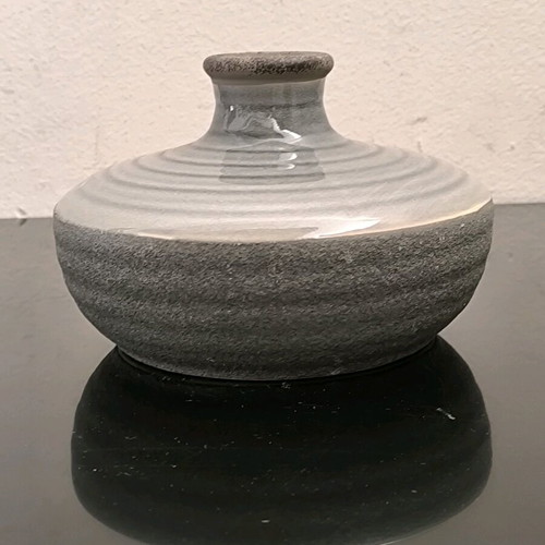 Ceramic low vase in gray shades like new