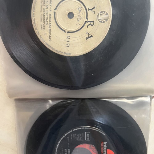 Vinyl 45 rpm records used, two cases with over fifty laiko and rembetika