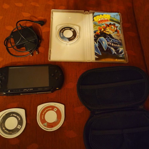 Sony PSP Street E1004 console with charger, case and 3 game cartridges