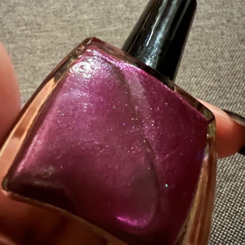 Nail polish with glitter in purple color like new