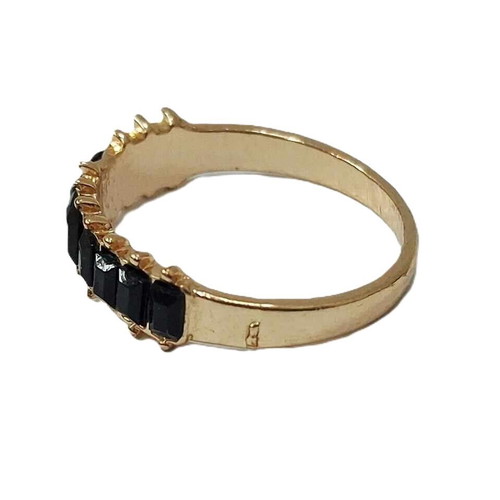 Eternity ring like new, gold color with black stones