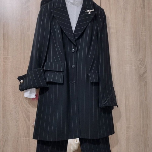 Women's black two-piece suit like new with white pinstripe size M
