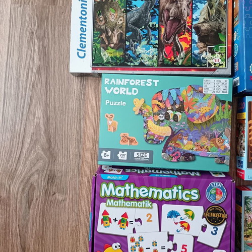 Children's puzzles and board games used, ages 4 to 8