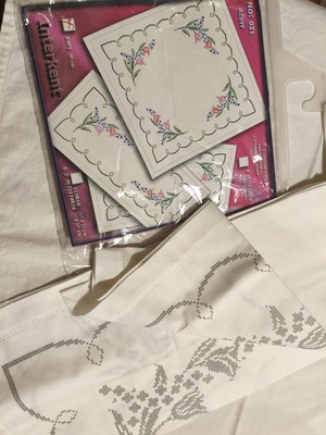 Interkent stamped cross-stitch design on linen-cotton fabric with ready hem and openwork