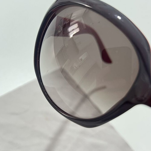 Christian Dior sunglasses used, black and red frame, lens scratched