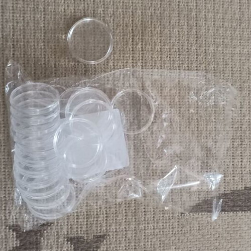 Coin holders new, 20 plastic with 4 cm radius and 9 with 2 cm radius