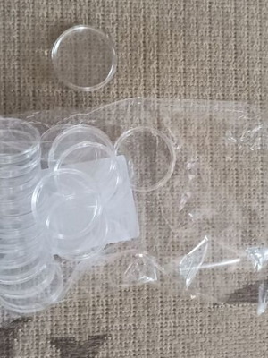 Coin holders new, 20 plastic with 4 cm radius and 9 with 2 cm radius