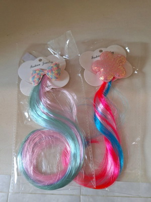 Set of children's hair extensions with star and bow clip
