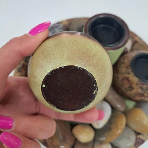 Tray with wooden candlesticks and colorful stones like new