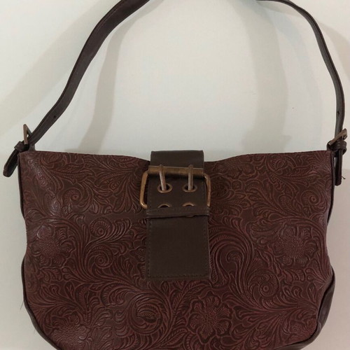 Women's brown shoulder bag used with embossed design