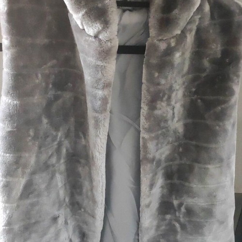 Synthetic sleeveless grey fur with hood