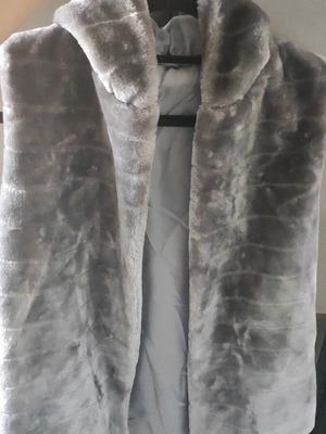 Synthetic sleeveless grey fur with hood